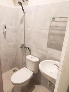 Koupelna v ubytování Al-Kiswah Syariah Guest House