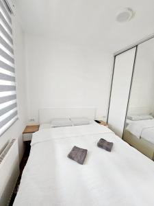 Ένα ή περισσότερα κρεβάτια σε δωμάτιο στο Apartman Aleksej Pale Jahorina