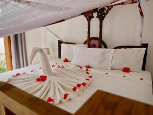 Postel nebo postele na pokoji v ubytování Boutique Ocean View Nungwi