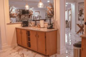 a kitchen with a counter top in a room at Bustamante Ranch - Sovereign Lodge in McDonough