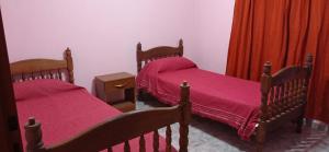 En eller flere senge i et værelse på Casa Rivadavia