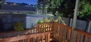 a wooden deck with christmas lights on a fence at 35 Amanda - Durbanville in Cape Town