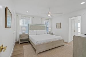 En eller flere senge i et værelse på The Blue Fin