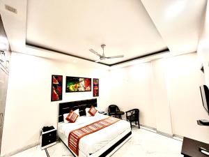 Ένα ή περισσότερα κρεβάτια σε δωμάτιο στο South Residency - South Delhi by South INN