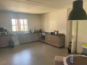 a large kitchen with a stoveasteryasteryasteryasteryasteryasteryasteryasteryasteryastery at premium farmhouse with pool Rabat in Rabat