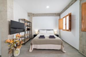 Ένα ή περισσότερα κρεβάτια σε δωμάτιο στο TrendyHomes Realejo