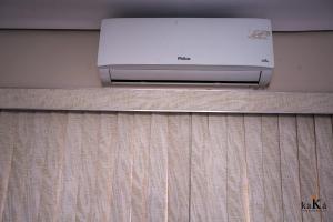 a printer sitting on top of a wooden shelf at Hostel Central in Uberlândia +47 photos