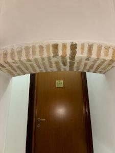 a large concrete beam above a door in a room at House Nonna Nina in Celano +27 photos
