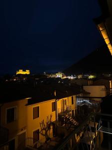 a view of a city at night from a balcony at House Nonna Nina in Celano