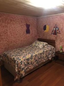 Postel nebo postele na pokoji v ubytování Hostal Hibisco