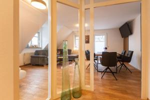 a view of a living room with a dining room at Apartment Norty in Hornberg