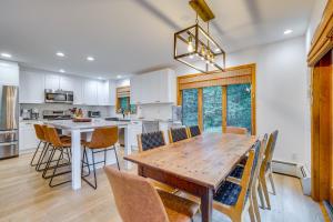 a kitchen and dining room with a wooden table and chairs at Spacious Dover Refuge about 5 Mi to Mount Snow! in Dover