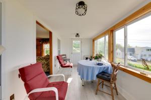 a dining room with a table and chairs at Waterfront Cottage - 17 Mi to Acadia Ntnl Pk! in Marlboro