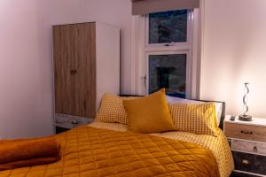 Ένα ή περισσότερα κρεβάτια σε δωμάτιο στο Lodging In Carrickfergus Centre