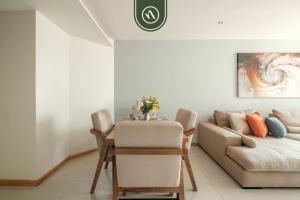a living room with a table and a couch at 2 BR Condo in Polanco with Pool and Gym in Mexico City