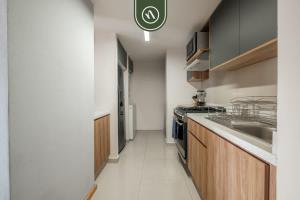 a kitchen with a sink and a stove at 2 BR Condo in Polanco with Pool and Gym in Mexico City