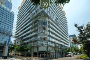 a tall building on a street in a city at 2 BR Condo in Polanco with Pool and Gym in Mexico City