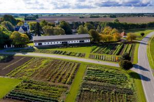 an aerial view of a farm with a building at Gatekeepers house in Søllested