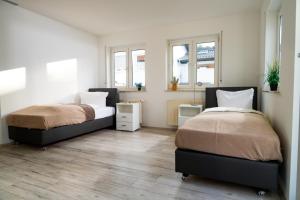 Postel nebo postele na pokoji v ubytování Maisonette 1