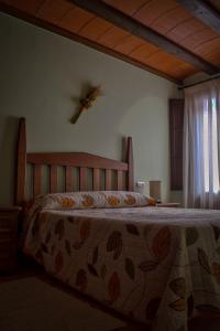 Llit o llits en una habitació de Apartamentos Casa La Cuca