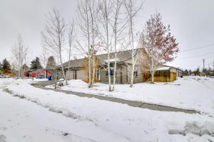 a house is covered in snow with trees at Cozy Belgrade Home Near Skiing, Hiking and Airport! in Belgrade