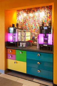 a colorful counter in a kitchen with a coffee shop at Inn at Northrup Station in Portland