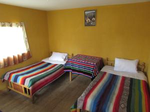 En eller flere senger på et rom på Titicaca Chaska Wasi Amantani