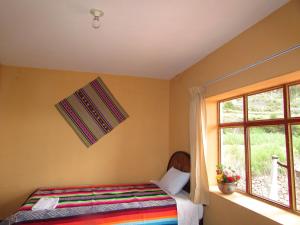 Krevet ili kreveti u jedinici u objektu Titicaca Chaska Wasi Amantani