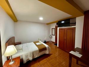 Postel nebo postele na pokoji v ubytování HOTEL LOS ANDES SUITE
