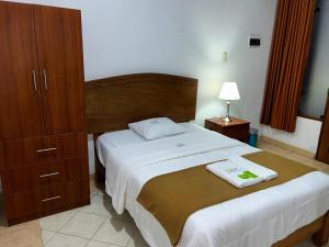 Postel nebo postele na pokoji v ubytování HOTEL LOS ANDES SUITE