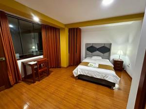 Postel nebo postele na pokoji v ubytování HOTEL LOS ANDES SUITE