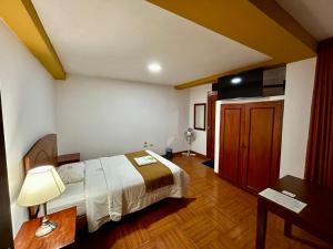 Postel nebo postele na pokoji v ubytování HOTEL LOS ANDES SUITE