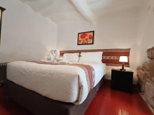 Postelja oz. postelje v sobi nastanitve Afma Cusco