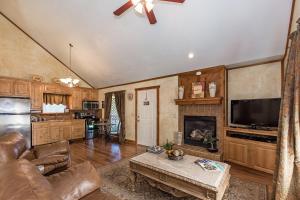 a living room with a couch and a fireplace at Appian Way Tuscan Cottage in Fredericksburg