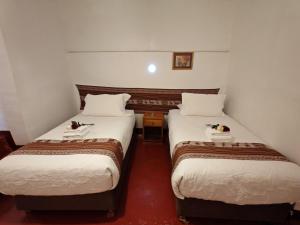 Postelja oz. postelje v sobi nastanitve Afma Cusco
