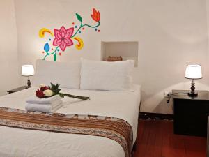 Postelja oz. postelje v sobi nastanitve Afma Cusco