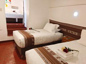 Postelja oz. postelje v sobi nastanitve Afma Cusco