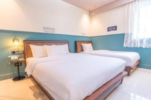Hotel Lemong客房内的一张或多张床位