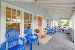 a group of blue chairs on a porch at Panama City Home with Beach Gear and 2 Bikes in Panama City