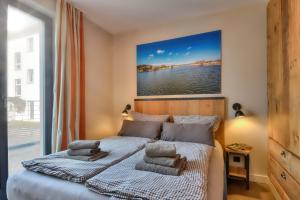Postel nebo postele na pokoji v ubytování Ferienwohnung Heimathafen Villa Martha Binz