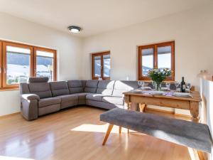 a living room with a couch and a table at Landhaus Christina Top 3 in Alpbach +34 photos