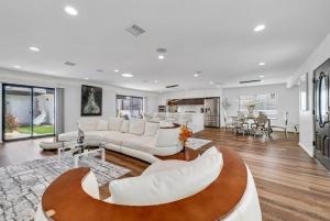 a living room with a white couch and a table at Luxury 4 bedroom villa in Huntington Beach