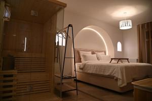 a bedroom with a bed and a glass closet at Suite and spa jacuzzi sauna proche Paris in Presles
