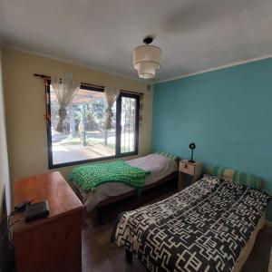 Katil atau katil-katil dalam bilik di Casita de la playa