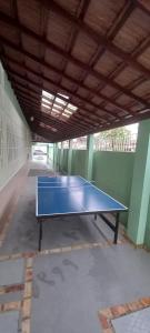 a ping pong table sitting inside of a building at Casa no Centro in Rio das Ostras
