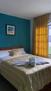 Una cama o camas en una habitación de Grand Río Hotel ec