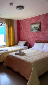 Una cama o camas en una habitación de Grand Río Hotel ec