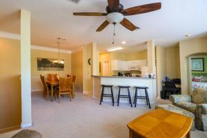 a living room and kitchen with a ceiling fan at Legacy Villa 304 in Gulfport
