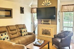 a living room with a couch and a television at 24th Street House in Gulfport