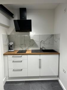 Kuchyň nebo kuchyňský kout v ubytování Chambre privée Wintzenheim